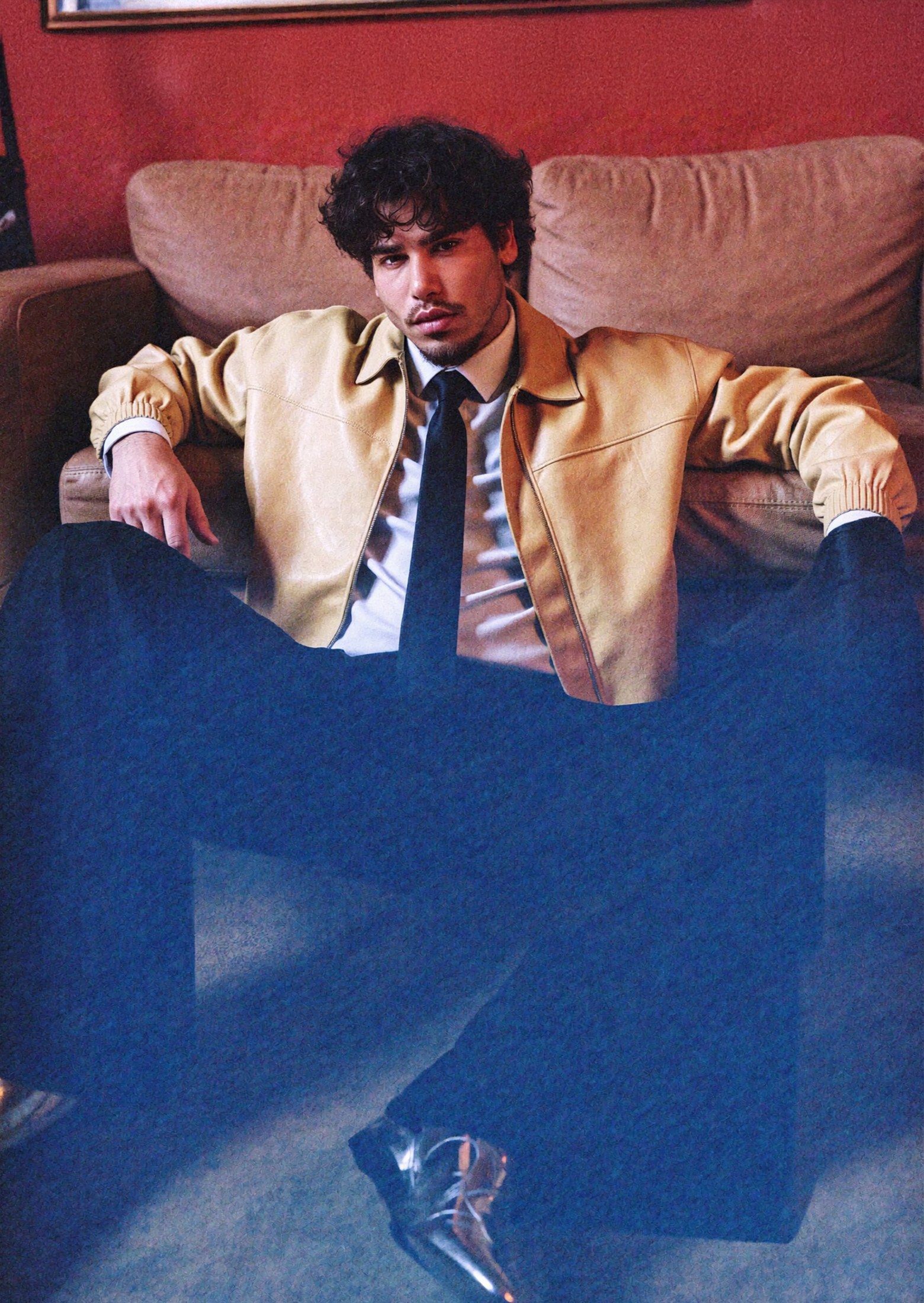 Adam Faybrem seated in a tan jacket